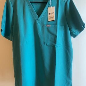 4 Catarina 1 pocket scrub tops. Large. 2 with new tags 2 washed once never worn.